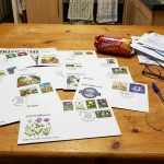 Why Your An Post First Day Issues Might Be Worth More Than You Think (2024 Valuation) 9 An Post first day issues and commemorative stamps laid out on a table