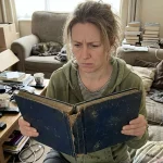 Where to Get Stamps Valued: 7 Red Flags & Who to Trust 5 A magnifying glass inspecting a rare vintage stamp for valuation